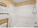 Tiled shower and white vanity with great storage in the bathroom at 9027 Kirkley Ct, Charlotte, NC 28277