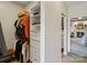 Walk-in closet with custom shelving and storage solutions, leading into a well-appointed bedroom at 9027 Kirkley Ct, Charlotte, NC 28277
