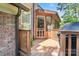 Outdoor deck, wooden plank flooring and a brick siding at 9027 Kirkley Ct, Charlotte, NC 28277