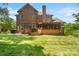 Brick house exterior featuring a deck and large backyard at 9027 Kirkley Ct, Charlotte, NC 28277