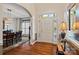 Bright foyer featuring hardwood floors and views into dining room at 9027 Kirkley Ct, Charlotte, NC 28277