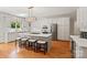 Modern kitchen with a large island, stainless steel appliances, and custom cabinets at 9027 Kirkley Ct, Charlotte, NC 28277