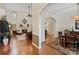 Open-concept living space with hardwood floors, fireplace, and elegant furnishings at 9027 Kirkley Ct, Charlotte, NC 28277