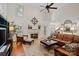Bright living area with a fireplace, leather sofa, and decorative rug at 9027 Kirkley Ct, Charlotte, NC 28277
