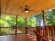 Inviting back deck with wood detailing and overhead fan, ideal for enjoying warm weather at 94 James Sw St, Concord, NC 28025