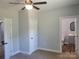 Bedroom featuring access to both a closet and an en-suite bathroom at 94 James Sw St, Concord, NC 28025