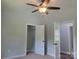 Bedroom with a neutral color scheme, closet, and entry to another room at 94 James Sw St, Concord, NC 28025