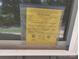 Close-up of a Building Permit posted on the property at 94 James Sw St, Concord, NC 28025