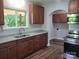 Modern kitchen featuring stainless steel appliances, granite countertops, and ample cabinet space at 94 James Sw St, Concord, NC 28025