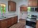 Spacious kitchen with stainless steel appliances, granite counters, and ample cabinet storage at 94 James Sw St, Concord, NC 28025