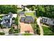Aerial shot of a brick home with a spacious driveway, well-maintained lawn, and mature trees at 1009 13Th Avenue Nw Pl # 19, Hickory, NC 28601