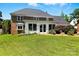 A well-maintained lawn, mature trees, and a sunroom add charm to this property's backyard at 1009 13Th Avenue Nw Pl # 19, Hickory, NC 28601
