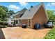 The backyard features a brick patio, mature landscaping, and a well-maintained lawn at 1009 13Th Avenue Nw Pl # 19, Hickory, NC 28601