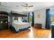 Bedroom featuring a bunk bed, wood floors, dark curtains, and natural light at 1009 13Th Avenue Nw Pl # 19, Hickory, NC 28601