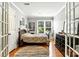 Bedroom featuring a bed with wood floors, natural light, and eclectic decor at 1009 13Th Avenue Nw Pl # 19, Hickory, NC 28601