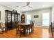 Elegant dining room with hardwood floors, china cabinet, and modern ceiling fan at 1009 13Th Avenue Nw Pl # 19, Hickory, NC 28601