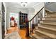 Elegant foyer showcasing a staircase, mud room with built-in storage, and chandelier lighting at 1009 13Th Avenue Nw Pl # 19, Hickory, NC 28601