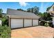 Large three-car garage with brick-paved driveway and mature landscaping at 1009 13Th Avenue Nw Pl # 19, Hickory, NC 28601
