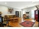 Cozy living room featuring hardwood floors, a unique wood coffee table and a colorful area rug at 1009 13Th Avenue Nw Pl # 19, Hickory, NC 28601