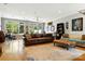 Spacious living room featuring hardwood floors, large windows and stylish decor at 1009 13Th Avenue Nw Pl # 19, Hickory, NC 28601