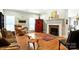 Cozy living room featuring hardwood floors, a unique wood coffee table, fireplace and a colorful area rug at 1009 13Th Avenue Nw Pl # 19, Hickory, NC 28601