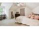 Cozy bedroom featuring a large window, comfortable bed, TV and sitting area at 1040 Goshen Pl, Charlotte, NC 28211