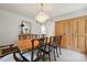 Dining room featuring hardwood floors, chandelier lighting, and wooden cabinetry at 1040 Goshen Pl, Charlotte, NC 28211