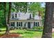 Charming home featuring dormer windows, neutral siding, black shutters and a manicured lawn at 1040 Goshen Pl, Charlotte, NC 28211