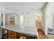Bright kitchen featuring a large center island with a concrete countertop and stainless steel appliances at 1040 Goshen Pl, Charlotte, NC 28211