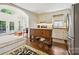 Open concept with a center island, hardwood floors, and a bright sitting area off the kitchen at 1040 Goshen Pl, Charlotte, NC 28211