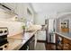 Bright kitchen featuring wooden countertops, stainless steel appliances, and subway tile backsplash at 1040 Goshen Pl, Charlotte, NC 28211