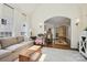 Inviting living room with hardwood floors, a decorative rug and an archway to the kitchen at 1040 Goshen Pl, Charlotte, NC 28211