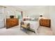 Serene main bedroom with ample natural light, neutral decor and multiple dressers for storage at 1040 Goshen Pl, Charlotte, NC 28211