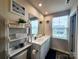 Bathroom featuring dual sinks, a large mirror, and modern fixtures at 1047 Campbell Chase Sw Ln, Concord, NC 28025