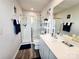 Bathroom featuring a glass-enclosed shower, white cabinets, and modern fixtures at 1047 Campbell Chase Sw Ln, Concord, NC 28025