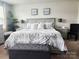 A beautifully decorated bedroom with a plush king-sized bed, stylish decor and a large window at 1047 Campbell Chase Sw Ln, Concord, NC 28025