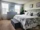 A beautifully decorated bedroom with a plush king-sized bed, stylish decor and a large window at 1047 Campbell Chase Sw Ln, Concord, NC 28025