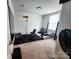Well-equipped exercise room with carpeted floors and window for natural light at 1047 Campbell Chase Sw Ln, Concord, NC 28025
