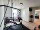 Well-equipped exercise room with weightlifting equipment and window for natural light at 1047 Campbell Chase Sw Ln, Concord, NC 28025