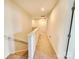Second floor hallway with carpet and white walls leading to bedrooms at 1047 Campbell Chase Sw Ln, Concord, NC 28025
