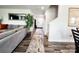 Spacious hallway with a decorative tree, runner rug, leading to the stairs and the front door at 1047 Campbell Chase Sw Ln, Concord, NC 28025