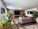 Cozy living room with a stone accent wall, modern fireplace, and comfortable seating at 1047 Campbell Chase Sw Ln, Concord, NC 28025
