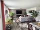 Spacious living room featuring a stone accent wall, modern fireplace, and comfortable seating area with stylish decor at 1047 Campbell Chase Sw Ln, Concord, NC 28025