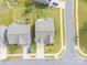 Aerial view of the property showcases the well-manicured lawn and landscaping at 1115 Macallum Nw Dr, Concord, NC 28027
