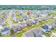 Charming neighborhood aerial view featuring well-maintained homes and green spaces with mature trees at 1115 Macallum Nw Dr, Concord, NC 28027