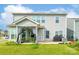The backyard features a patio with seating and a grill, as well as a well-maintained lawn at 1115 Macallum Nw Dr, Concord, NC 28027