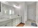 Bathroom featuring a double sink vanity, granite countertops and a large mirror at 1115 Macallum Nw Dr, Concord, NC 28027