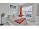 Cozy bedroom featuring a storage bed, large window, and neutral decor at 1115 Macallum Nw Dr, Concord, NC 28027