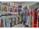 Walk-in closet provides ample storage with organized racks and shelves for clothes and accessories at 1115 Macallum Nw Dr, Concord, NC 28027