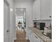 Hallway view leading to dining area and featuring lots of cabinet storage at 1115 Macallum Nw Dr, Concord, NC 28027